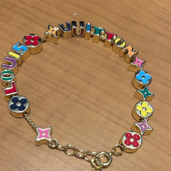 Louis Vuitton colored gold Logo Bracelet - Picture 2 of 4